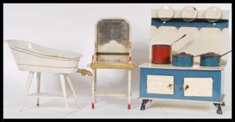 A group of vintage early 20th Century large scale dolls house / childrens tinplate furniture
