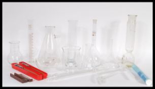 A collection of vintage 20th Century Scientific medical lab glass and instruments to include various