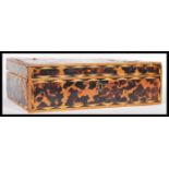 A 19th Century Indian blonde tortoiseshell work box of rectangular form having hinged lid opening to