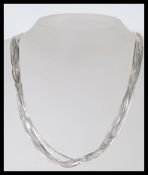A stamped 925 silver necklace having multiple snake chains with a spring ring clasp. Total weight