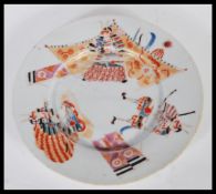 A 19th Century Japanese plate hand decorated with Samurai warriors and standards having character