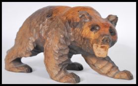 A 20th Century fine hand carved wooden Japanese large figurine in the form of a bear. 14cm high by