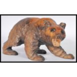 A 20th Century fine hand carved wooden Japanese large figurine in the form of a bear. 14cm high by