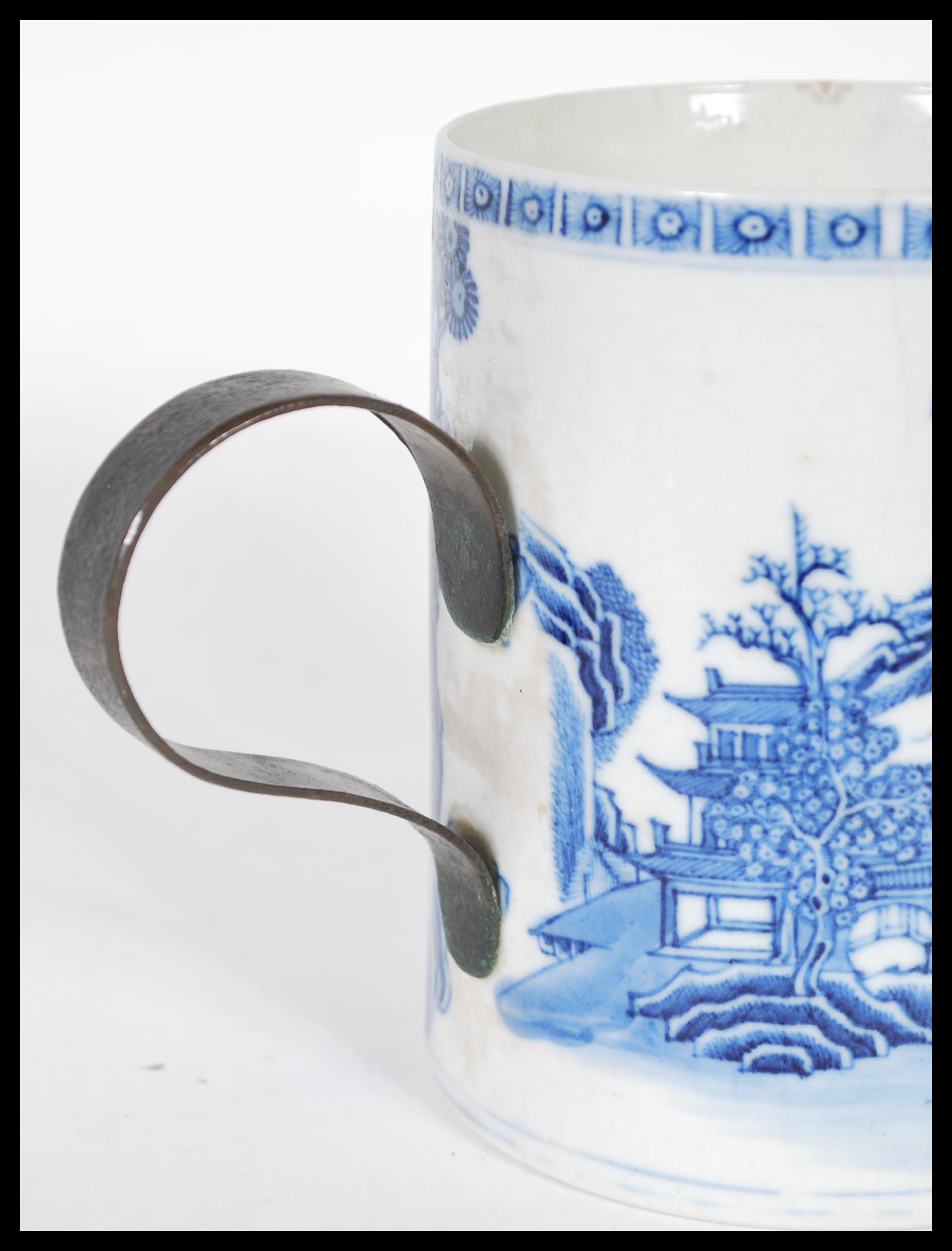 An 18th Century ceramic blue and white glazed brush pot having a later applied iron scroll handle, - Image 4 of 6