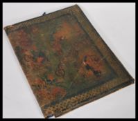 An early 20th Century leather embossed tooled Chinese stationery organiser letter wallet. The case