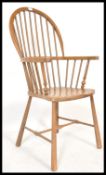 An early 20th Century beech and ash Windsor chair of good proportions having shaped saddle seat