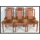 A set of six vintage retro 20th Century G Plan teak dining chairs raised on shaped legs with bergere