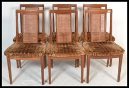 A set of six vintage retro 20th Century G Plan teak dining chairs raised on shaped legs with bergere