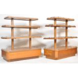 A PAIR OF MID CENTURY BRITISH OAK SHOP PAGODA DISPLAY STANDS