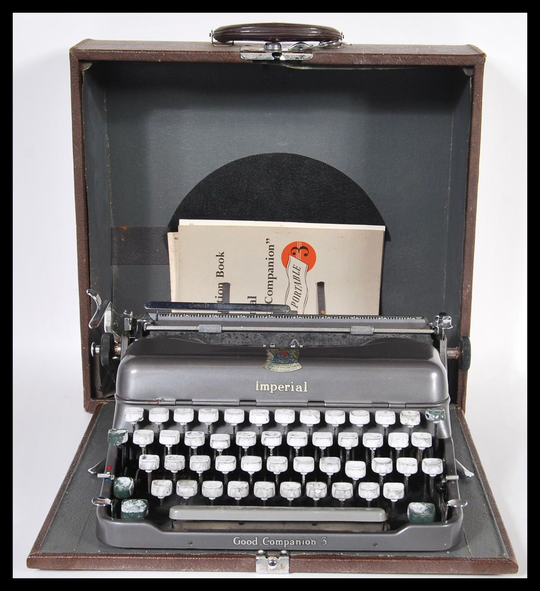 A vintage mid 20th Century Imperial portable typewriter complete in its original carry case.