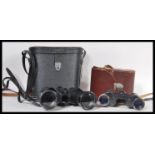 Two pairs of vintage 20th Century binoculars to include a pair of Carl Zeiss Jena Jenoptem 8x30 W