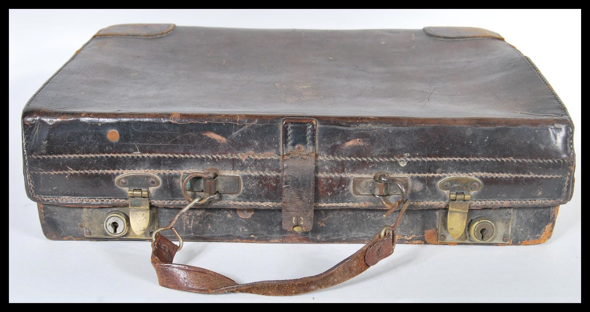 A vintage 20th Century leather attache / briefcase, Carry handle atop with brass locks to the front, - Image 3 of 4