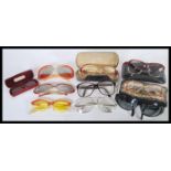 A collection of vintage retro 20th Century sunglasses to include mostly examples with plastic