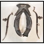 A large 19th Century Victorian leather working horse collar haim together with a pair of 19th