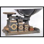 A 19th Century Victorian industrial grocers weighing scales, the balance scales in original ebonised