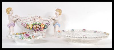 Three 20th Century Schierholz porcelain items to include a pierced decoration brown with raised hand