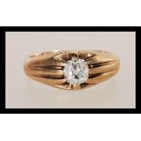 A 9ct gold single stone ring having an old cut diamond of approx 50 pts with split shoulders and