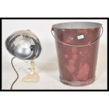 A vintage 20th Century desk top heat lamp by Pifco together with a vintage 20th Century painted fire