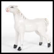 A 19th Century Victorian Staffordshire pearlware fireside figurine in the form of a horse having dip