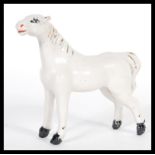 A 19th Century Victorian Staffordshire pearlware fireside figurine in the form of a horse having dip