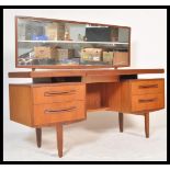 A vintage retro 20th Century retro teak wood G-Plan Kelso dressing table having pedestals of drawers