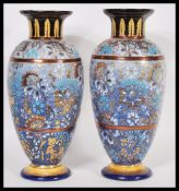 A pair of early 20th Century Royal Doulton Slaters patent stoneware vases of tall front with salt