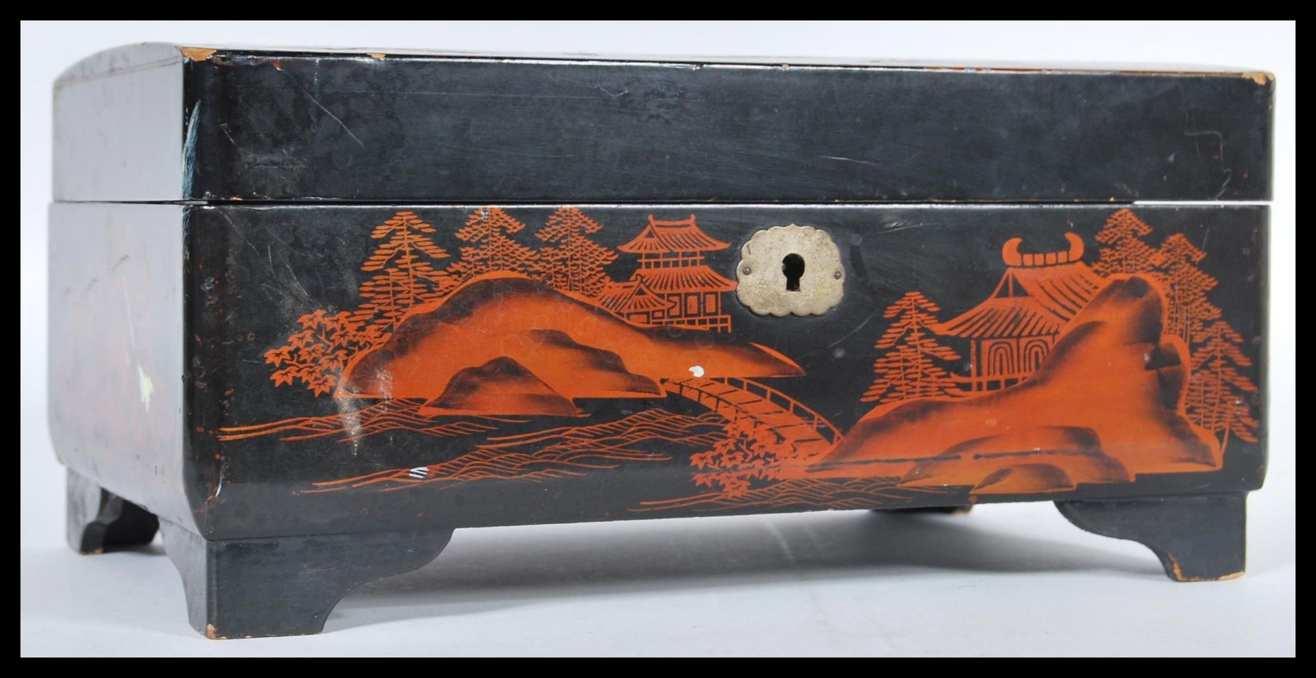 A 20th Century Japanese black lacquer jewellery box having hand painted and abalone shell inlaid