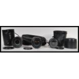 A collection of three Canon digital camera lenses to include a zoom lens EF70-300mm 1 : 4-5.6 1S