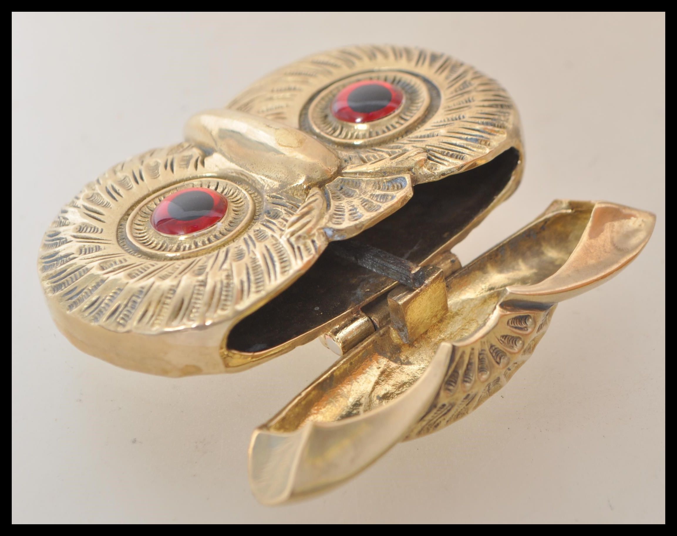 A brass vesta case in the form of an owl having red and black glass eyes, and match striker to the - Image 3 of 3
