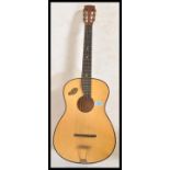 A vintage retro 20th Century Spanish acoustic six string guitar by Martin Callerti having a shaped