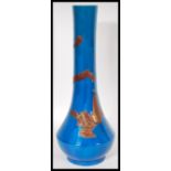 A 20th Century Chinese opalescent monochrome vase in blue. The vase having gilt relief decoration