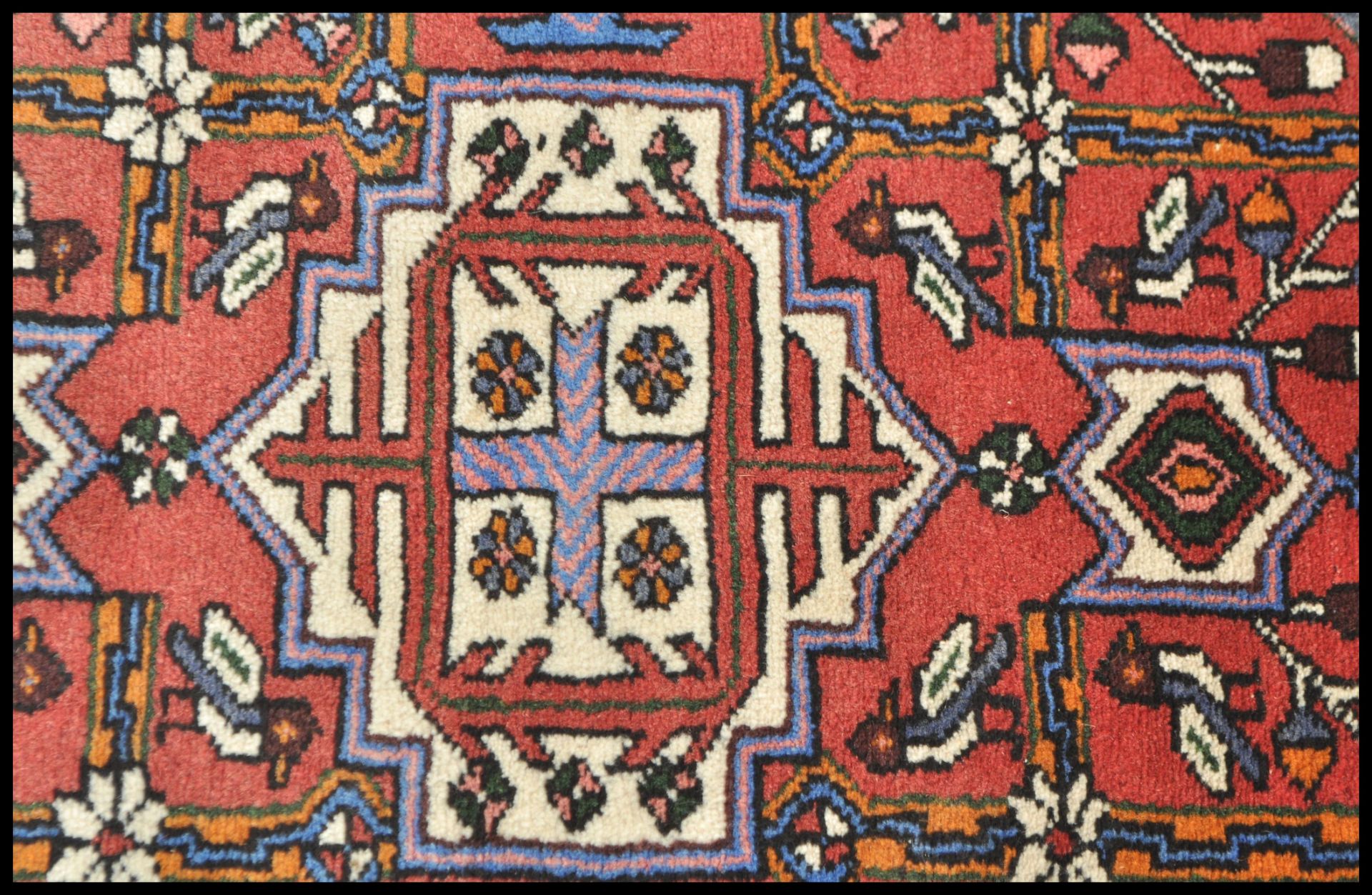 A 20th Century Persian carpet floor rug having a red ground with central tree of life panel and - Bild 2 aus 4