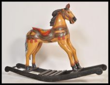 A large vintage 20th Century carousel type rocking horse raised on sleigh rockers with painted