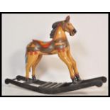 A large vintage 20th Century carousel type rocking horse raised on sleigh rockers with painted