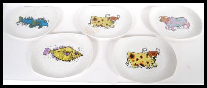 A group of five vintage retro 20th Century Washington Pottery vibrant decorated plates from the
