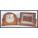 A pair of early 20th Century Art Deco mantel clocks one being an oak cased example and the other a