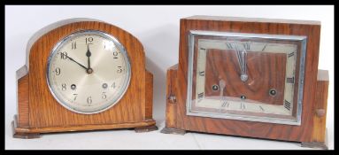 A pair of early 20th Century Art Deco mantel clocks one being an oak cased example and the other a