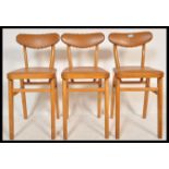 A set of three vintage / retro mid 20th Century beech dining chairs, the beech frames of angular