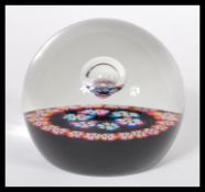 A vintage 1970's Caithness William Manson studio art glass paperweight having millefiori canes and