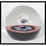 A vintage 1970's Caithness William Manson studio art glass paperweight having millefiori canes and