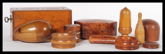 A good collection of antique treen to include an 18th Century Georgian snuff box, eggs, sewing