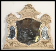 A Large 19th Century wall / overmantel mirror with three shaped mirror panels, and a carved wood and