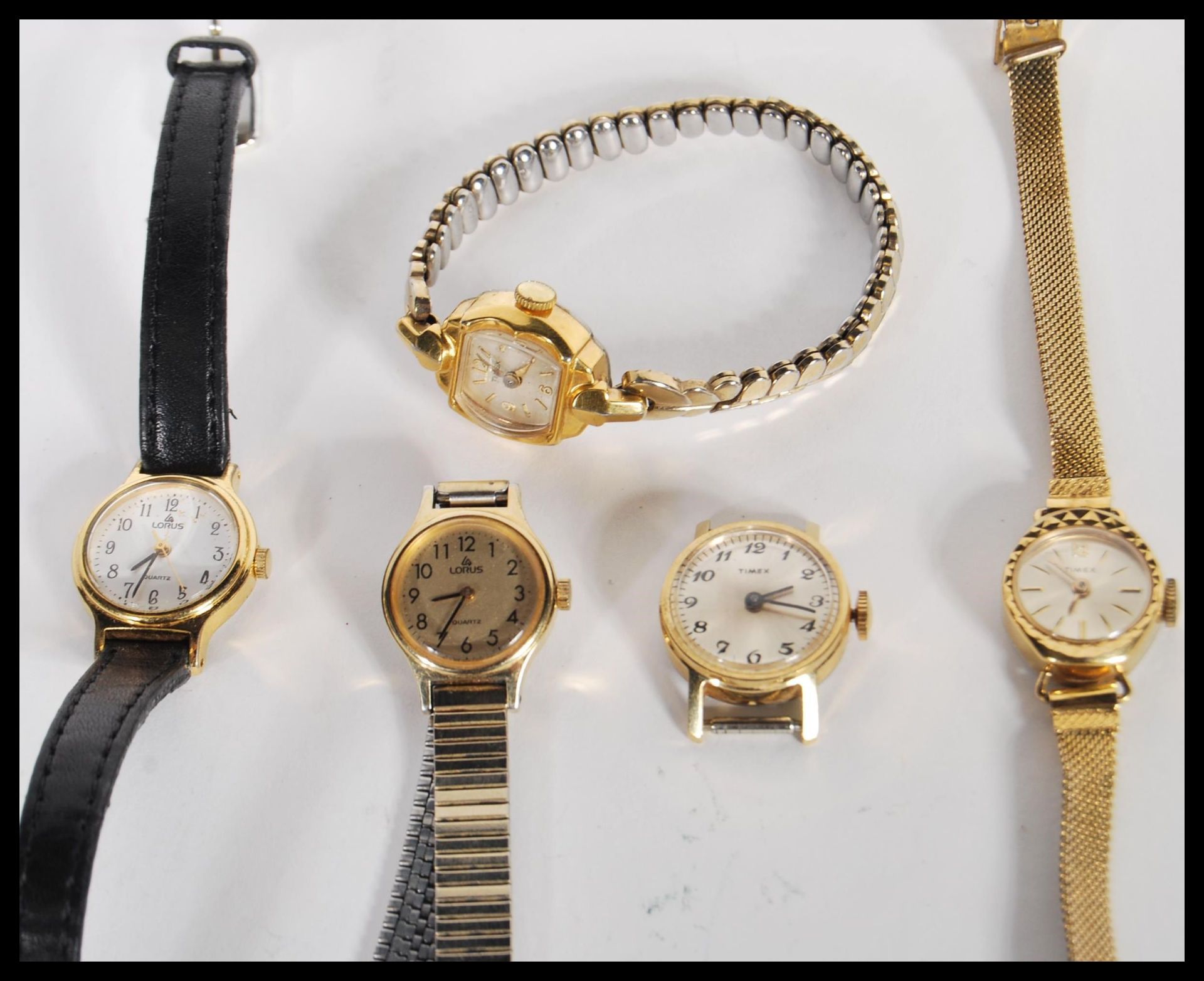 A selection of vintage 20th Century ladies cocktail watches to include three Timex watches and two