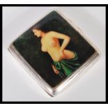 An early 20th Century hallmarked silver cigarette case by Frederick Field having erotic nude panel