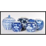 A selection of graduating 20th Century Chinese ginger jars, having hand painted cherry blossoms on a