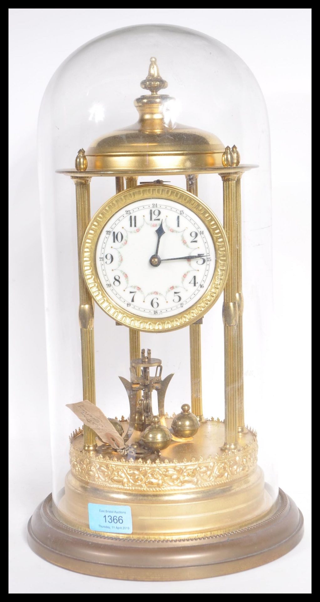 A large 19th Century Victorian glass domed anniversary clock raised on gilt brass circular base with