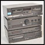 A three piece Technics hi-fi system to include a HX PRO Stereo Double Cassette Deck RS-TR313, a