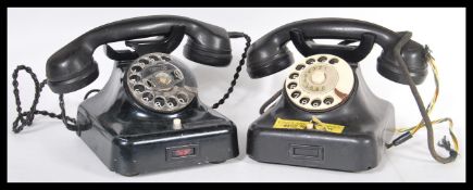 A pair of vintage 20th Century retro industrial office bakelite ring dial telephones having ring