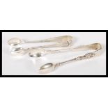 Two pairs of silver hallmarked sugar tongs, one pair with apostle in relief, London assay, dating to