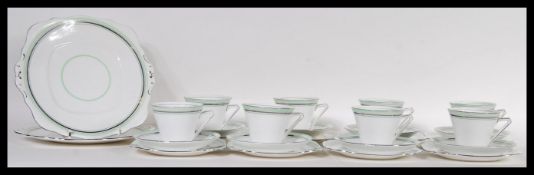 A 20th Century Art Deco Tuscan china English tea service consisting of two large cake plates, six